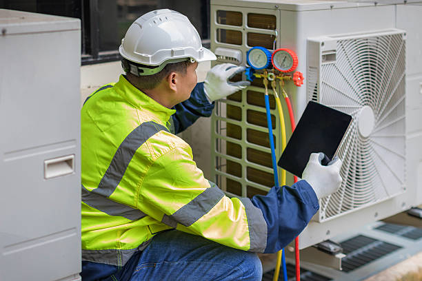 Professional Air Duct Cleaning technician working in East Peoria, IL